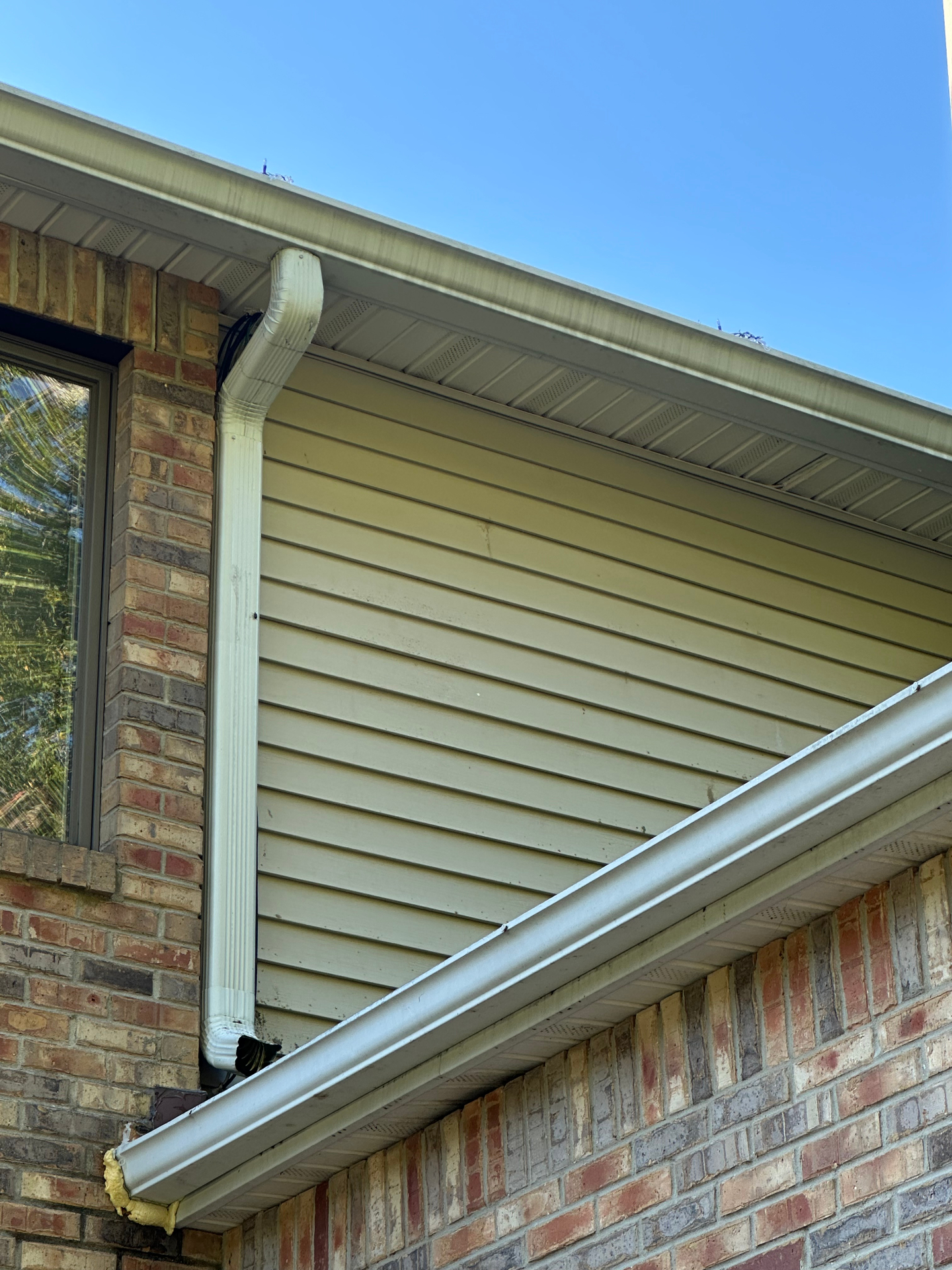 Clean siding and gutters after pressure washing